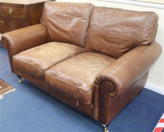 A brown leather settee W.160cm